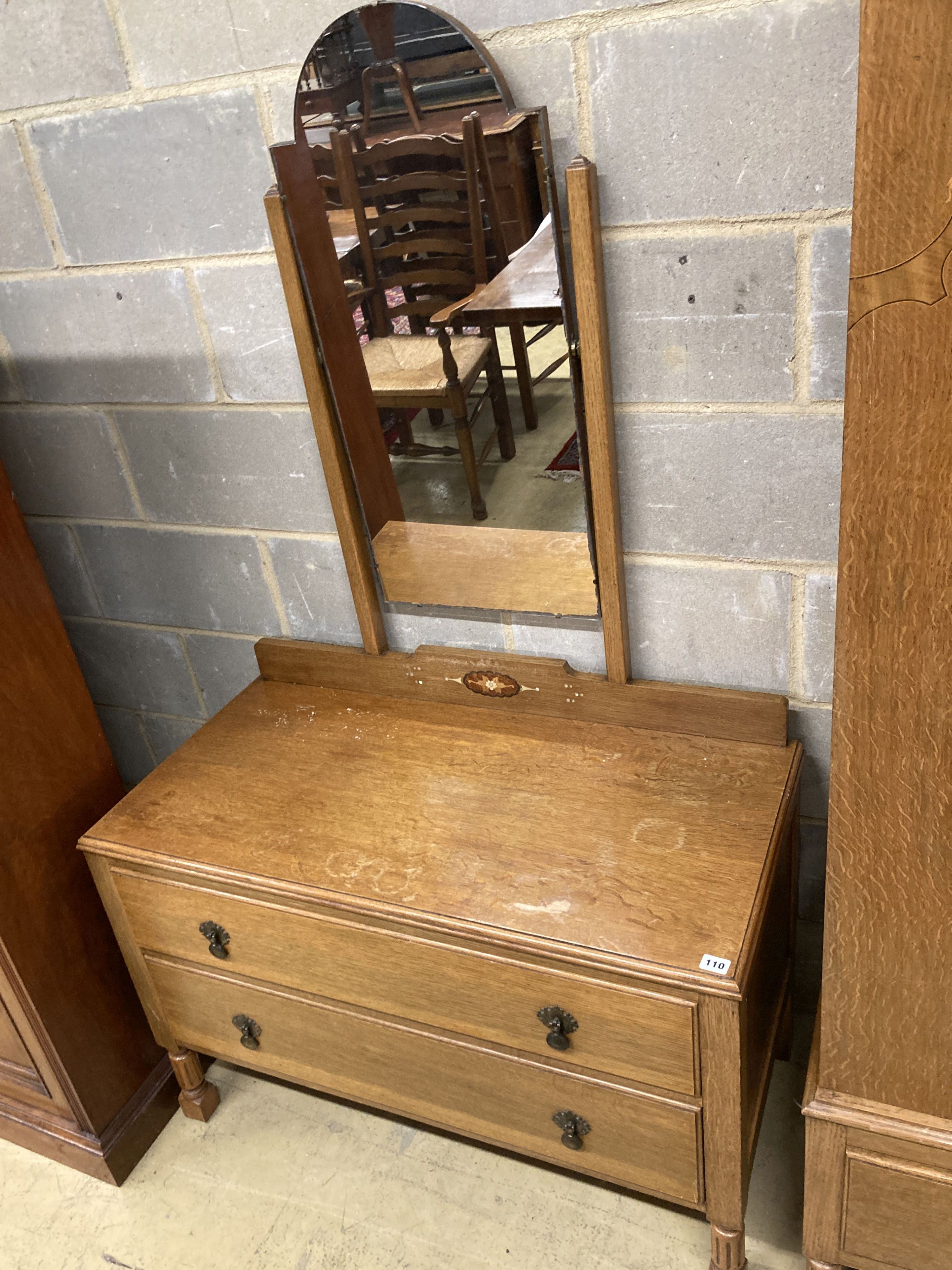 An early 20th century inlaid oak three piece bedroom suite, wardrobe width 106cm, depth 43cm, height 193cm